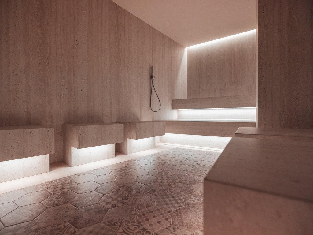 Al Latemar, dopo le passeggiate: relax nella Spa Oniro Interno di sauna moderna con sedili in pietra e illuminazione soffusa